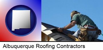 a roofing contractor installing asphalt roof shingles in Albuquerque, NM