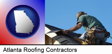a roofing contractor installing asphalt roof shingles in Atlanta, GA
