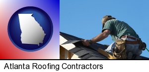 Atlanta, Georgia - a roofing contractor installing asphalt roof shingles