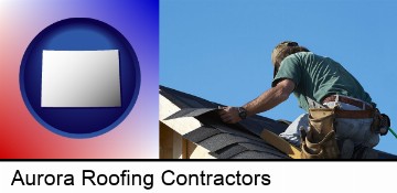 a roofing contractor installing asphalt roof shingles in Aurora, CO