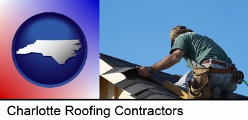 a roofing contractor installing asphalt roof shingles in Charlotte, NC