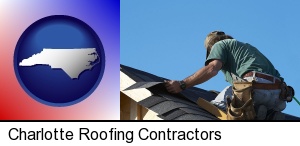 Charlotte, North Carolina - a roofing contractor installing asphalt roof shingles