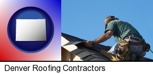 Denver, Colorado - a roofing contractor installing asphalt roof shingles