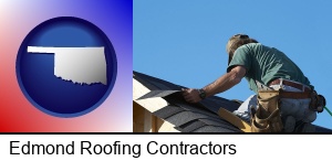 Edmond, Oklahoma - a roofing contractor installing asphalt roof shingles