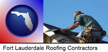 a roofing contractor installing asphalt roof shingles in Fort Lauderdale, FL