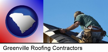 a roofing contractor installing asphalt roof shingles in Greenville, SC