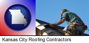 Kansas City, Missouri - a roofing contractor installing asphalt roof shingles