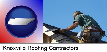 a roofing contractor installing asphalt roof shingles in Knoxville, TN