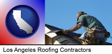 a roofing contractor installing asphalt roof shingles in Los Angeles, CA