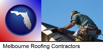 a roofing contractor installing asphalt roof shingles in Melbourne, FL