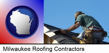 a roofing contractor installing asphalt roof shingles in Milwaukee, WI