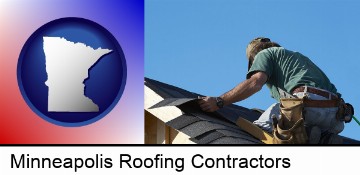 a roofing contractor installing asphalt roof shingles in Minneapolis, MN