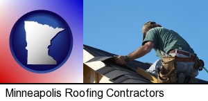 Minneapolis, Minnesota - a roofing contractor installing asphalt roof shingles