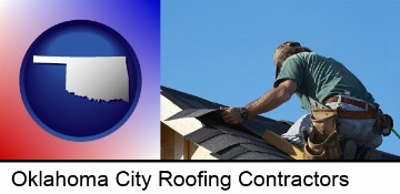 a roofing contractor installing asphalt roof shingles in Oklahoma City, OK