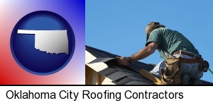 Oklahoma City, Oklahoma - a roofing contractor installing asphalt roof shingles
