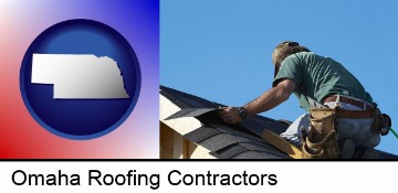 a roofing contractor installing asphalt roof shingles in Omaha, NE