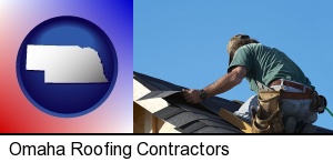 Omaha, Nebraska - a roofing contractor installing asphalt roof shingles