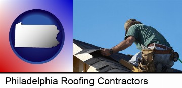 a roofing contractor installing asphalt roof shingles in Philadelphia, PA