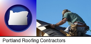 Portland, Oregon - a roofing contractor installing asphalt roof shingles