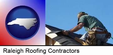 a roofing contractor installing asphalt roof shingles in Raleigh, NC