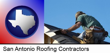 a roofing contractor installing asphalt roof shingles in San Antonio, TX