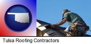 Tulsa, Oklahoma - a roofing contractor installing asphalt roof shingles