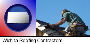 Wichita, Kansas - a roofing contractor installing asphalt roof shingles