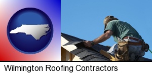 Wilmington, North Carolina - a roofing contractor installing asphalt roof shingles