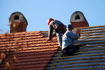 roofers installing a tile roof