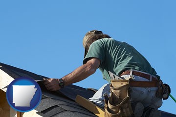 a roofing contractor installing asphalt roof shingles - with Arkansas icon