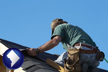a roofing contractor installing asphalt roof shingles - with Washington, DC icon