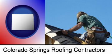 a roofing contractor installing asphalt roof shingles in Colorado Springs, CO