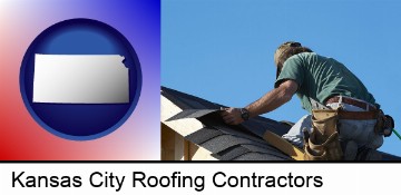 a roofing contractor installing asphalt roof shingles in Kansas City, KS