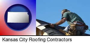 Kansas City, Kansas - a roofing contractor installing asphalt roof shingles