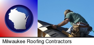 Milwaukee, Wisconsin - a roofing contractor installing asphalt roof shingles