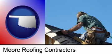 a roofing contractor installing asphalt roof shingles in Moore, OK