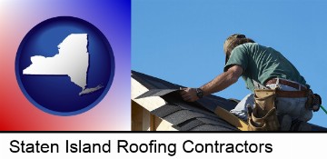 a roofing contractor installing asphalt roof shingles in Staten Island, NY